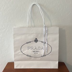 Authentic Prada embossed gift bag and ribbon